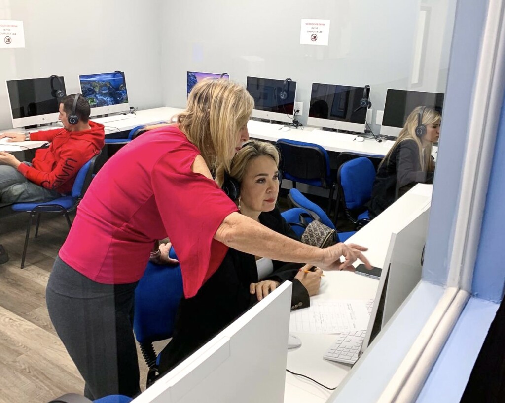teacher and student in a computer lab